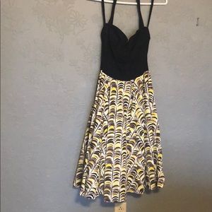 Halter-top dress with flared skirt.